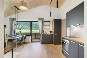 a kitchen and dining room with a table and a dining room at Stackler54 - mit Balkon in Neustift im Stubaital