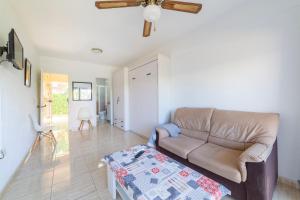 a living room with a couch and a table at Gaviotas 4 in Aguadulce