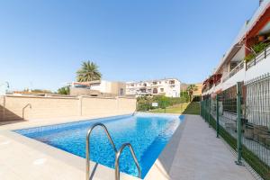 a swimming pool in the middle of a building at Gaviotas 4 in Aguadulce