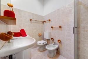 a bathroom with a sink and a toilet and a shower at The Waterfall Chalet in La Salle