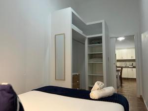 a bedroom with a bed with two towels on it at Casa Eusebia in Arona