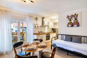 a living room with a couch and a table at Aposto Apartments 1 in Oberderdingen