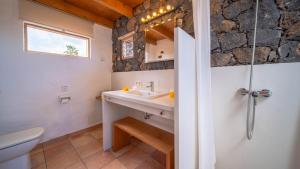 a bathroom with a sink and a toilet at Casa Margarita 2 in Mala +2 photos