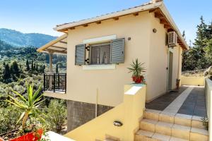 a villa with a view of a house at Alkionides Apartment 3 in Agios Nikitas