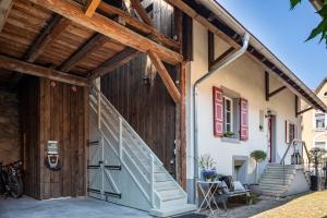 a house with a staircase on the side of it at Kleiner Hof Rosenrot in Endingen