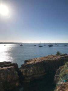 a large body of water with boats in the water at Estoril Sea You in Estoril