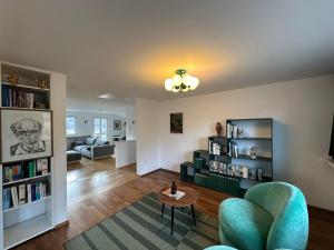 a living room with a couch and a table at Auerer Retreat in Frauenau