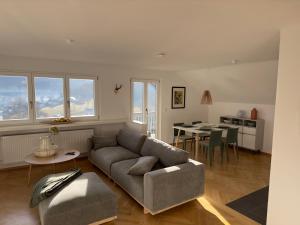 a living room with a couch and a table at Auerer Retreat in Frauenau