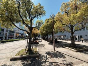 a park with trees and a street light at Lucky民泊 in Osaka