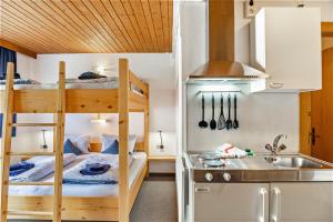 a small kitchen with bunk beds in a room at Studio Hochzillertal mit Sauna in Ried im Zillertal