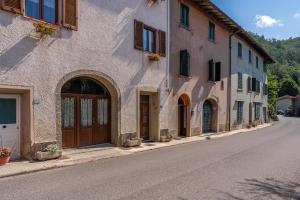 an empty street in a village with buildings at Casa Gaia in Prataccio