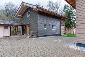 a house with a large driveway in front of it at Chalet Rauschn 1 in Farchant