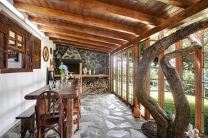 a room with a table and a tree in it at Finca Las Carmenes in Icod de los Vinos