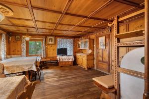 a bedroom with a bed and a television in a room at Oberhof Bauernhaus in Vallarga