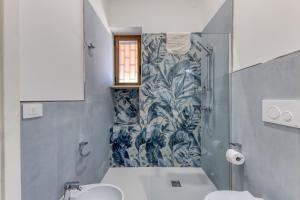 a bathroom with a shower and a sink and a toilet at Le Colonie - Pescoluse in Presicce +94 photos