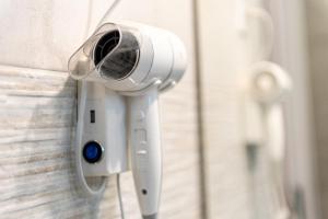 a security camera attached to a wall at Cefalù Seaside Pool Villa in Cefalù