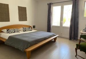 a bedroom with a bed with two pillows on it at Casa Harriet in Mijas +38 photos