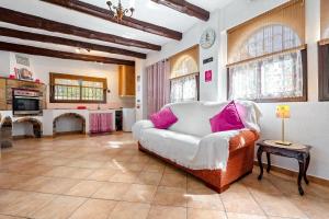 a living room with a couch and a fireplace at Can Wancho in Botarell