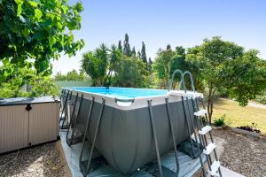 a swimming pool in a yard with at Can Wancho in Botarell +24 photos
