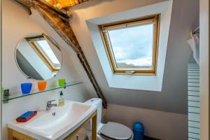 a bathroom with a sink and a mirror at Chambres d'hôtes Exotique in Saint-Jory-las-Bloux