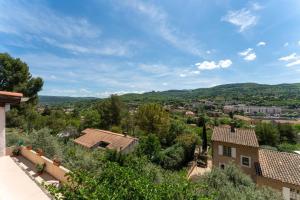 a view of a town from a house at Villa du soleil levant in Apt