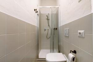 a bathroom with a shower and a toilet at Workation Castle in Carlazzo +31 photos