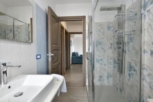 a bathroom with a sink and a shower at Dolcecasa in Dorgali