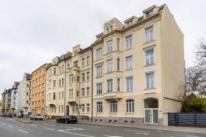 a large building on the side of a street at Gera Apartment in Gera