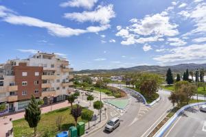 a view of a street in a city with a building at Casa Axarquia 2 in Vélez-Málaga