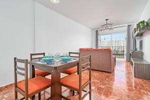 a dining room with a table and chairs in a room at Casa Axarquia 2 in Vélez-Málaga