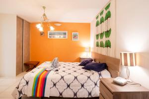 a bedroom with a large bed and a table at Gure Xokoa in Urrugne