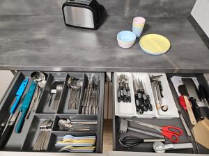 a drawer filled with lots of tools on a counter at Ferienoase Weitblick in Rinteln