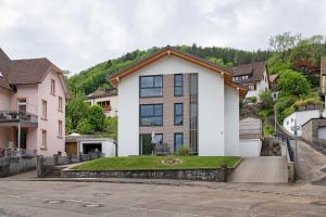 a house with a hill in the background at Wanderlust in Todtnau