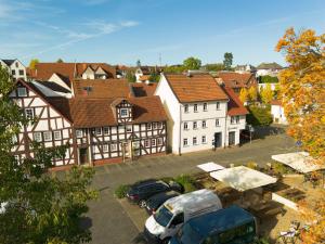 an aerial view of a town with cars parked in a parking lot at Lauterbach im Herzen der Altstadt in Lauterbach