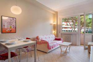 a living room with a table and a chair at Solaria in Rapallo