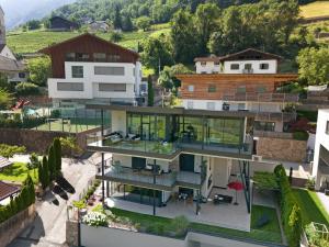 an aerial view of a house with glass at New Opening Vinea Guesthouse in Cornedo all'Isarco