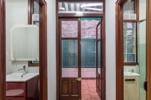 a bathroom with two sinks and a mirror at Apto Casco viejo Castro Urdiales in Castro-Urdiales +21 photos
