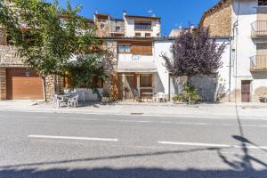 a street with a building on the side of the road at Casa Ramona in Conques