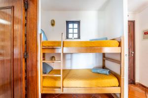 a group of bunk beds in a room at Casa N's in Albufeira +22 photos