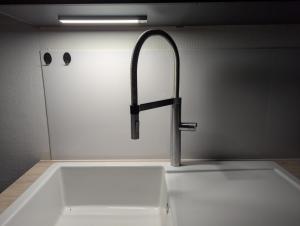 a sink with a faucet in a kitchen at Ferienwohnung Lichtenstein in Lichtenstein