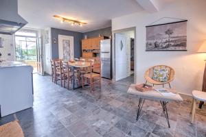 a kitchen and dining room with a table and chairs at Maison familiale à Archignac in Archignac