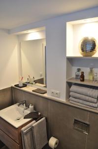 a bathroom with a sink and a mirror at Feichten Glück 16 in Siegsdorf +13 photos