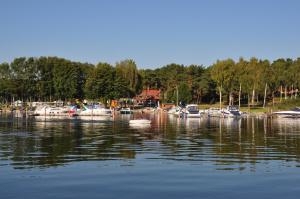 a group of boats are docked in the water at Ferienwohnung Maribell in Jabel