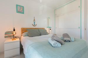 a bedroom with a bed with two towels on it at Surf Home Sea View in Costa de Antigua +27 photos