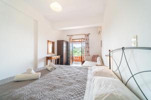 a bedroom with a bed in a room at Arianna Studio Ground Floor 5 in Paleokastritsa
