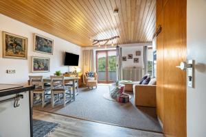 a living room with a couch and a table at Apartment Grundblick in Bad Grund