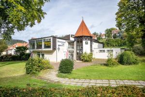 a house with an orange roof at Apartment Grundblick in Bad Grund