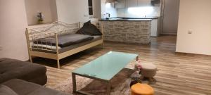 a living room with a couch and a table at Käfer A in Waldbrunn +2 photos
