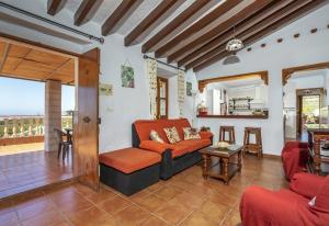 a living room with a couch and a table at El Puntal de Nieves in Nerja