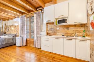 a kitchen with a sink and a microwave at Moli in Oden +14 photos